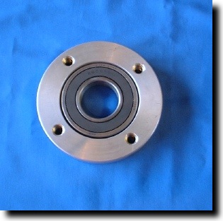 Bearing block and sealed bearing